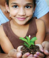 girl holding plant